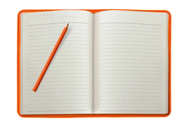 Оранжевый блокнот с карандашом — стоковое фото