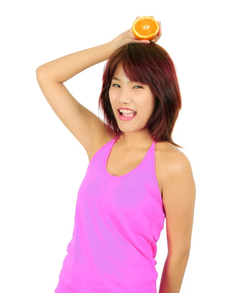 Isolated young asian woman with pieces of orange — Stock Photo, Image