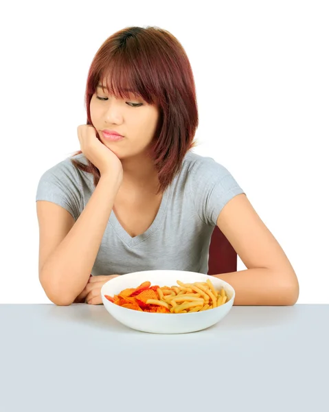 Isolated young asian woman with a plate of potato chips and fren — Stock Photo, Image