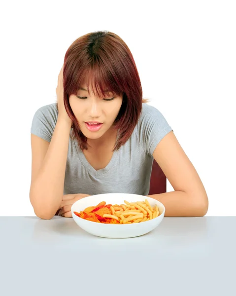 Isolated young asian woman with a plate of potato chips and fren — Stock Photo, Image