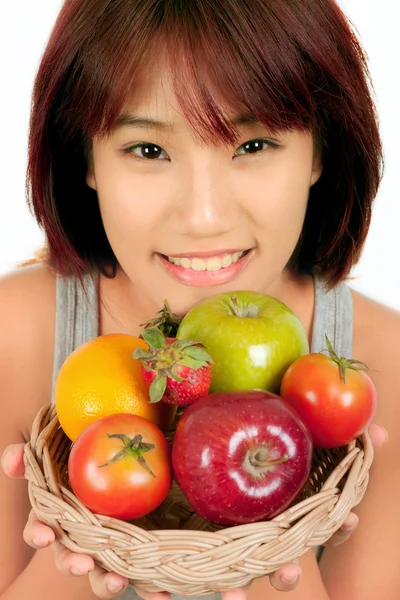 Isolato giovani asiatico donna con vari frutti — Foto Stock