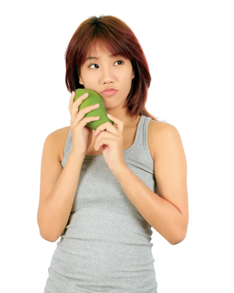 Geïsoleerde jonge Aziatische vrouw met een mango over Wit. — Stockfoto