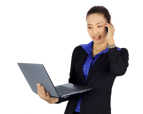 Isolated young business woman on a cell phne with laptop compute — Stock Photo, Image