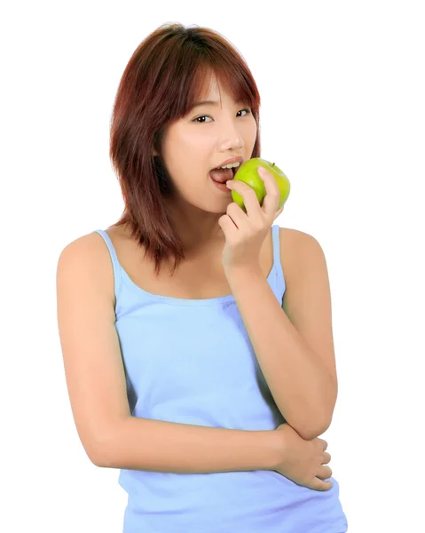 Isolated young asian woman with a green apple. Royalty Free Stock Images