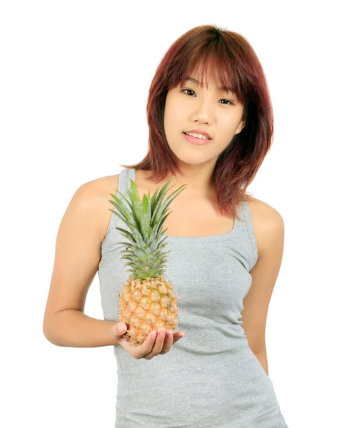 Isolated young asian woman with pineapple — Stock Photo, Image