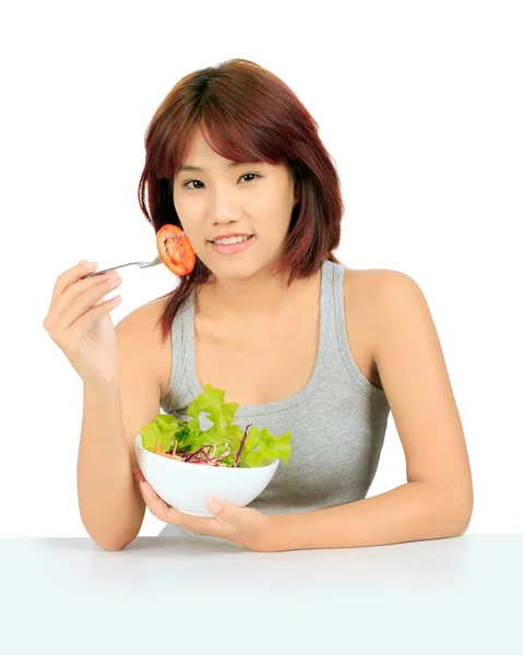 Isolado jovem asiático menina com uma tigela de salada — Fotografia de Stock