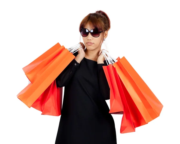 Isolated young asian woman carries shopping bags — Stock Photo, Image