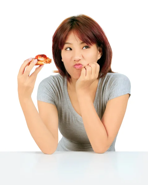 Isolated young asian woman with a piece of pizza — Stock Photo, Image