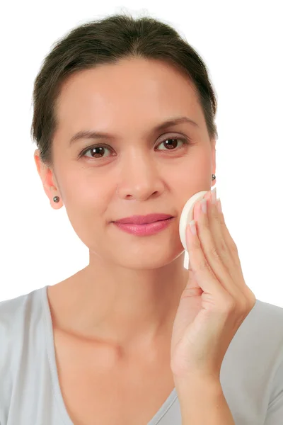 Isolated middle age woman with a cleansing puff — Stock Photo, Image
