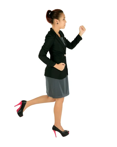 Isoliert laufende junge Geschäftsfrau auf weiß. — Stockfoto