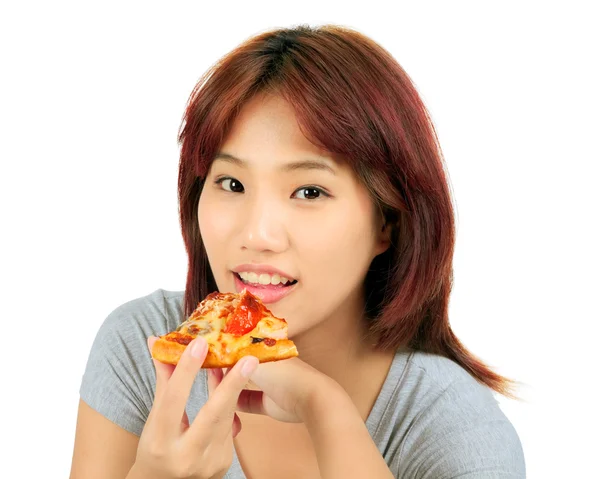 Isolated young asian woman with a piece of pizza — Stock Photo, Image