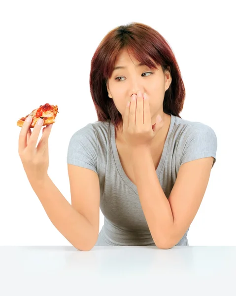 Isolated young asian woman with a piece of pizza — Stock Photo, Image