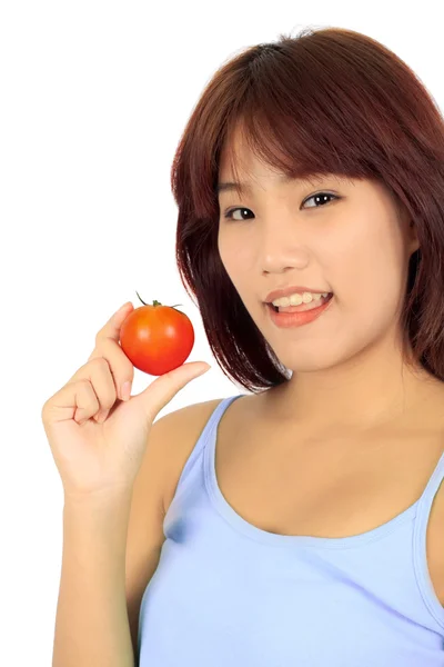 Mladá asijská žena s rajčaty — Stock fotografie