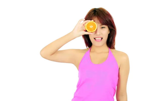 Isolated young asian woman with pieces of orange — Stock Photo, Image