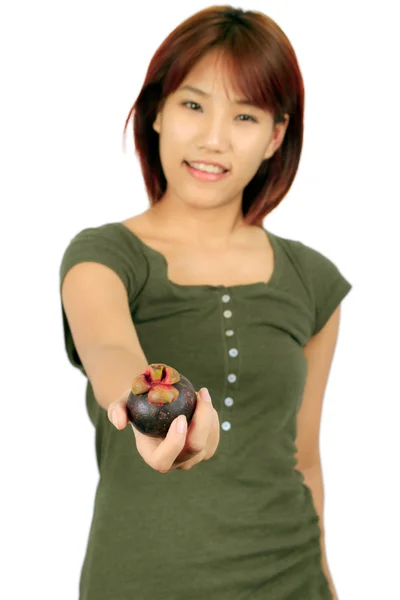 Isolated young asian woman with a mangoesteen over white. — Stock Photo, Image