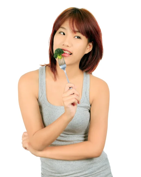 Isolado jovem asiático mulher com um pedaço de brócolis — Fotografia de Stock
