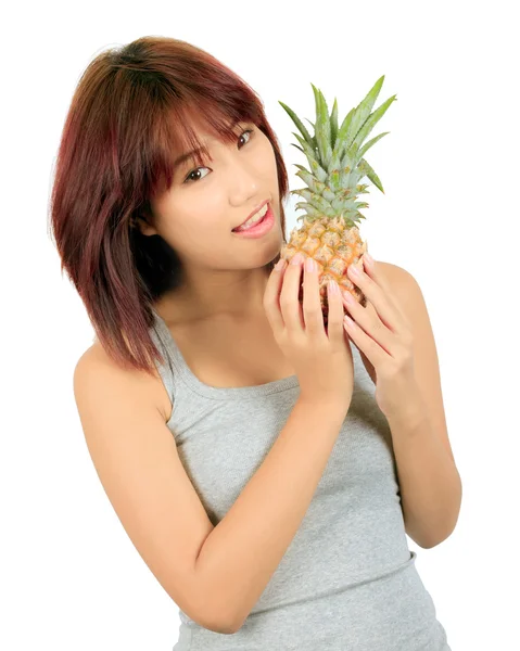 Isolated young asian woman with pineapple — Stock Photo, Image