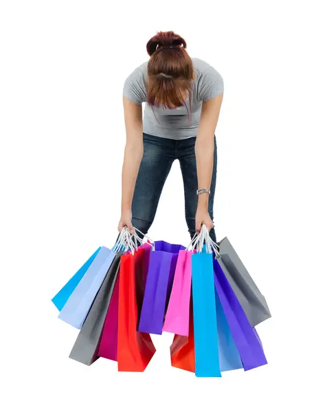 Geïsoleerde jonge Aziatische vrouw met shopping tassen — Stockfoto