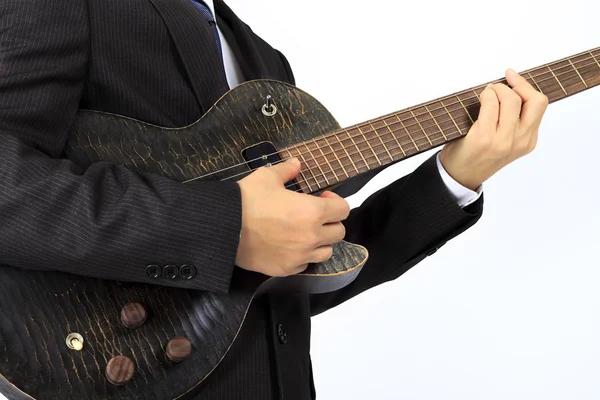 Hombre asiático con una guitarra eléctrica negra —  Fotos de Stock