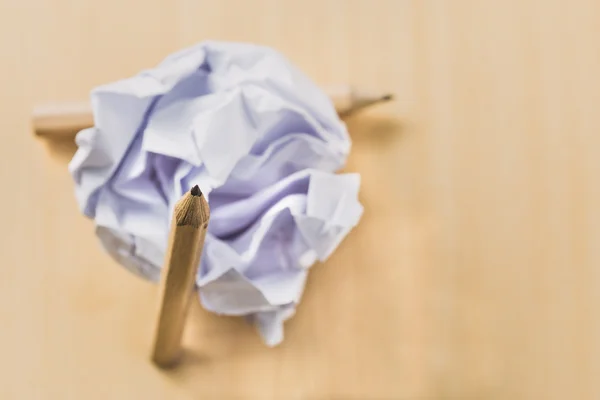 Pencils with a piece of crumpled paper ball — Stock Photo, Image