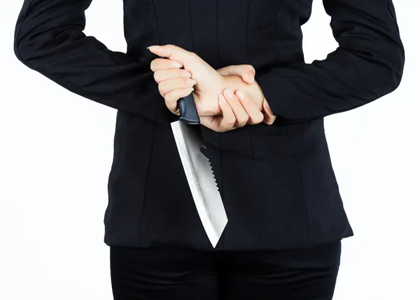 Back of business woman with aknife — Stock Photo, Image