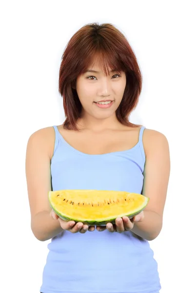 Isolated young asian woman with a piece of yellow watermelon — Stock Photo, Image