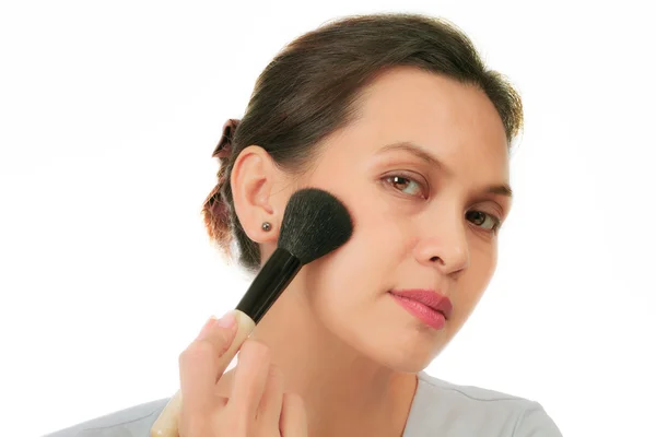 Middle age asian woman with make up brush. — Stock Photo, Image