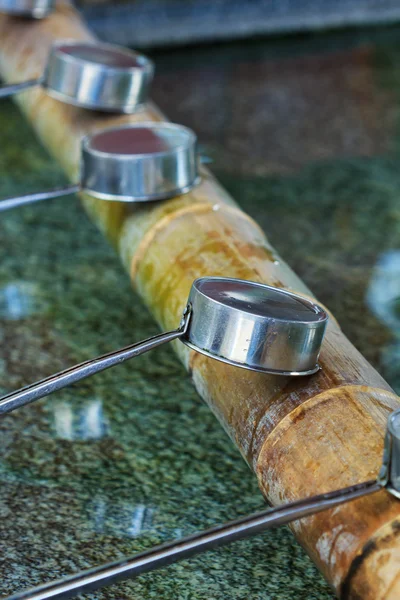 Japanese water deippers in a Japanese shrine — Stock Photo, Image