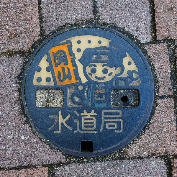 Momotaro character on a Manhole in Okayama — Stock Photo, Image