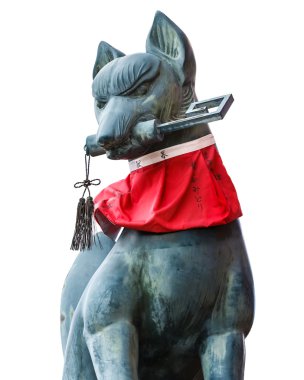 Kitsune sculpture at Fushimi Inari-taisha shrine in Kyoto clipart