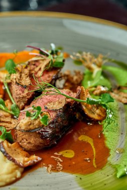 Medium rare beef steak. Selective focus, close-up. Noise grain in post-production