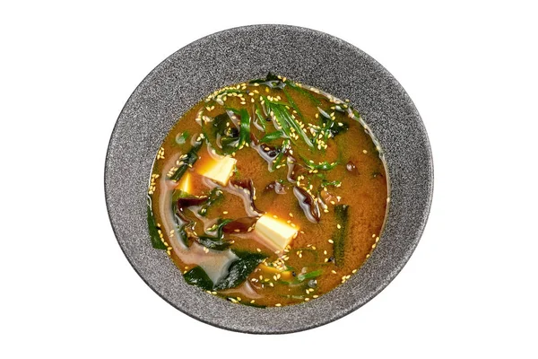 stock image Miso soup with shiitake, tofu and seaweed in a bowl on a white background