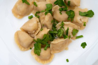 Maydanozlu haşlanmış hamur tatlısı. Geleneksel hamur tatlısı, halk mutfağı