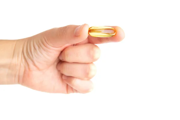Hand Holding Translucent Fish Oil Pill Isolated White Background — 图库照片
