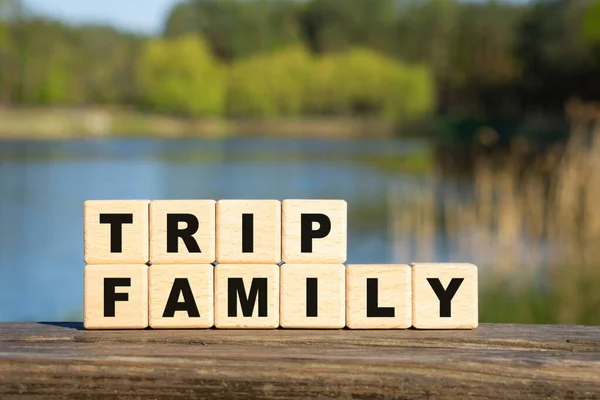 Text Family Trip Made Wooden Alphabet Blocks Lake Background Family — Stock Photo, Image