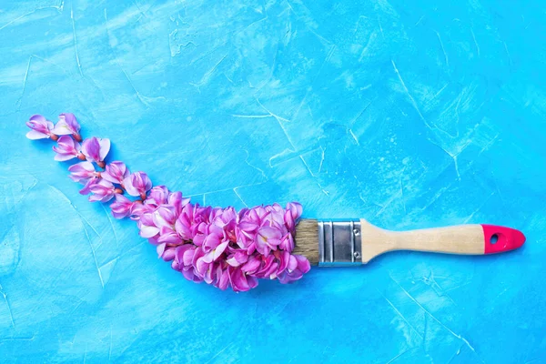 Paint Brush Stroke Made Pink Acacia Petals Blue Textured Background — Stock Photo, Image