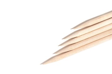 Orange wood manicure sticks isolated on white background. Nail beauty industry product.