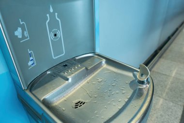 Close-up of a drinking fountain and bottle filling station at the airport