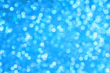 Abstract background made from defocused blue and white light circles.