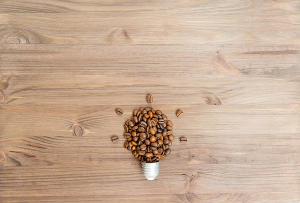 Glowing Lightbulb Symbol Made Roasted Coffee Beans Cap Wooden Table — Fotografia de Stock