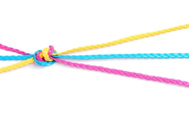 Braided cords painted pink, blue and yellow knotted together isolated on white background. Creative cooperation and teamwork concept.