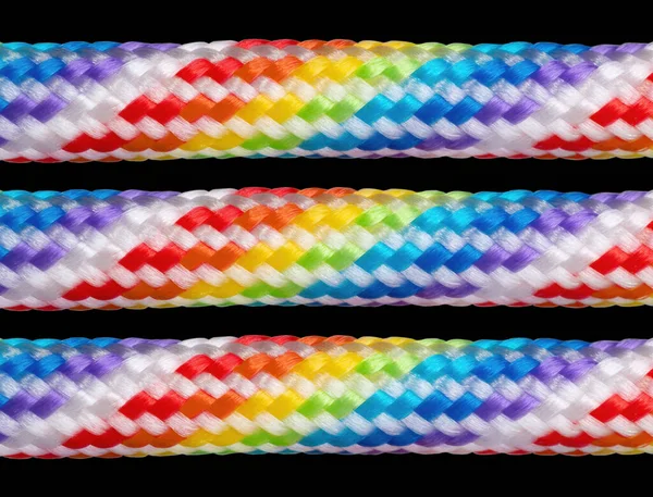 Three Rainbow Colored Braided Cotton Cords Isolated Black Background — Fotografia de Stock