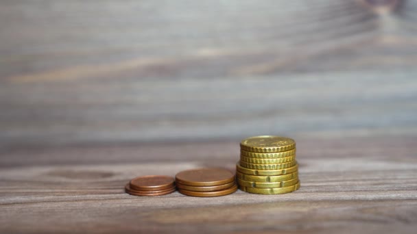 Hand Puts Small House Model Coins Stack Wooden Background Mortgage — Videoclip de stoc