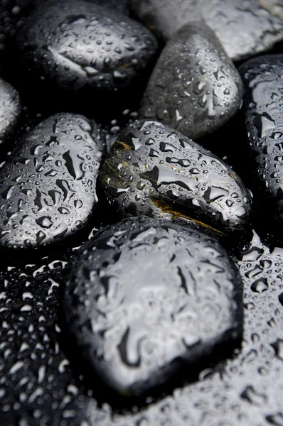 Mokré černé kameny — Stock fotografie