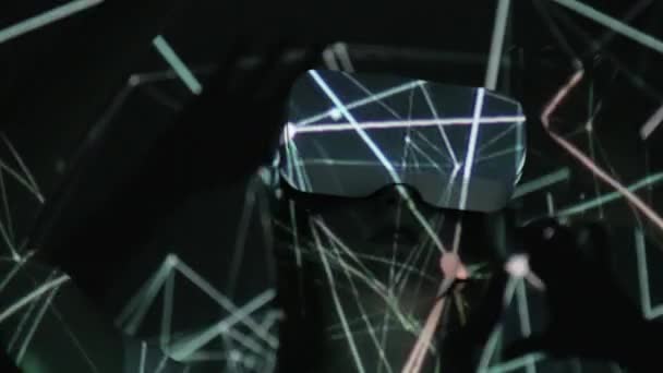 Visualization of metadata. Woman in VR glasses. Virtual reality in a helmet — Stockvideo