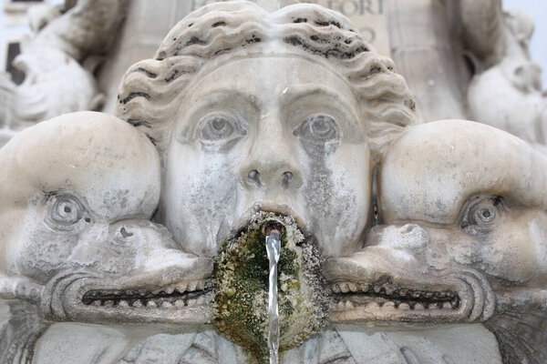 Active antique fountain in the city square, Italy, Rome