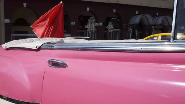 Pink retro convertible door, Cuba, Havana