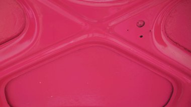 Inside of a car trunk lid (door) of a pink retro car