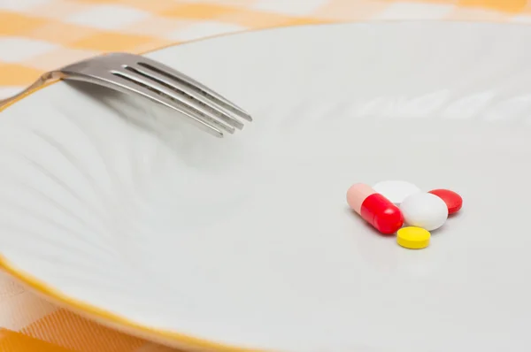 Pastillas en un plato — Foto de Stock