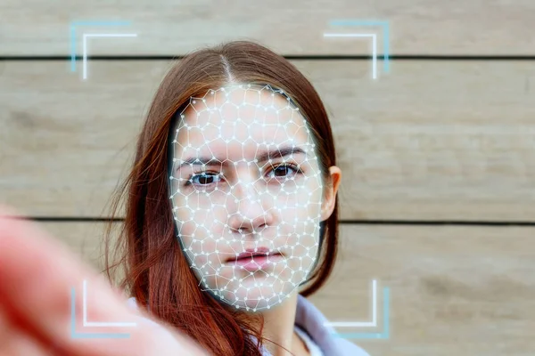 Young woman face during ai authentication biometrics. Fotos De Stock Sin Royalties Gratis